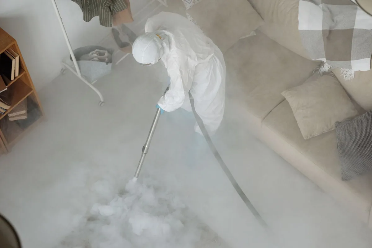Biohazard cleanup technician in protective equipment, Muscle Shoals, AL